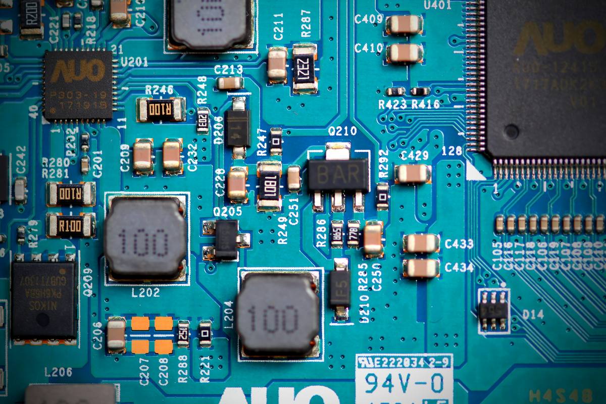 Close-up of a circuit board showing resistors, capacitors and copper tracks